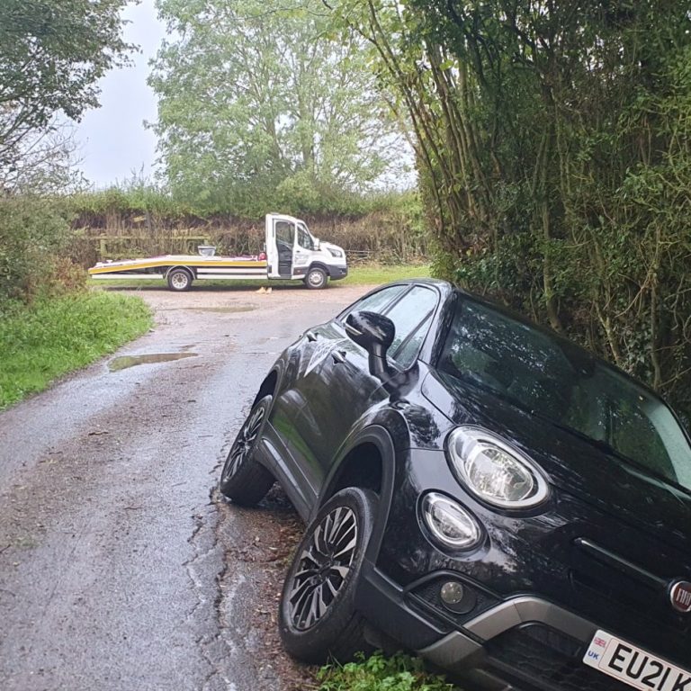 Car Recovery out of muddy Ditch